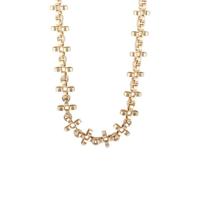 PANTOLIN CROSS CHAIN NECKLACE GOLD SHORT Elegant och välarbetad halslänh från Pantolin. Länkarna är formade som små kors och knäpps med ett diskret lås.